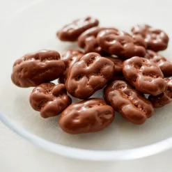 New Muji Nueces pecanas cubiertas de chocolate con leche